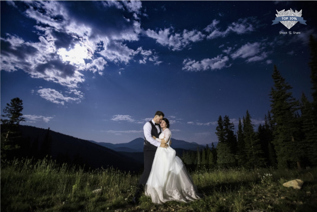 Night portrait of wedding couple bride and groom at Timber Ridge in Keystone