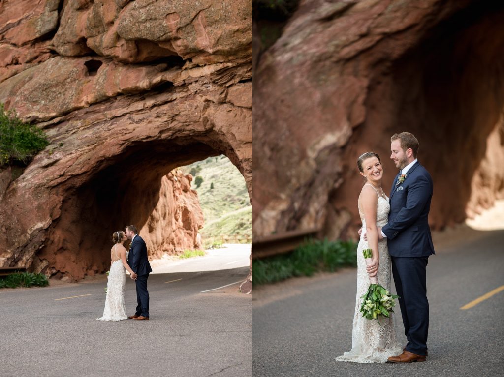 groom and bride pose together near rock tunnel at red rocks park