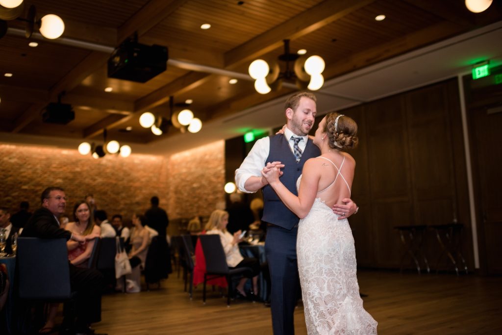 bride and groom share first dance during their downtown denver wedding reception 