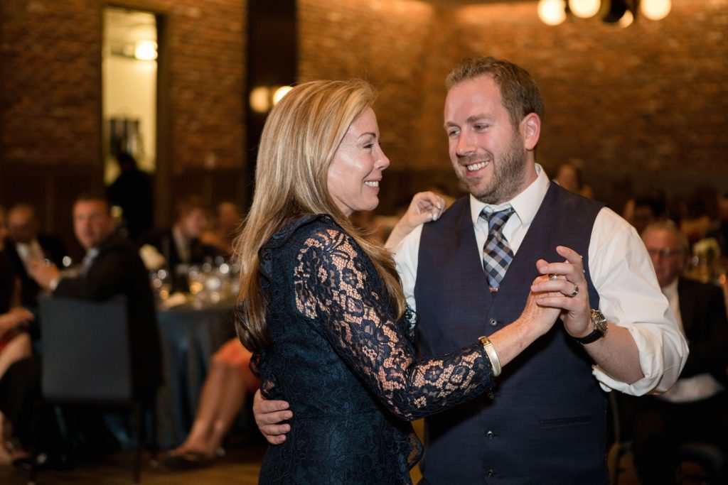 groom dances with his mother during his downtown denver wedding