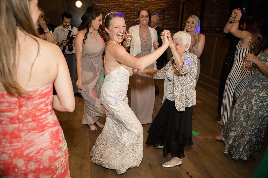 bride dances with her grandma at her downtown denver wedding reception 