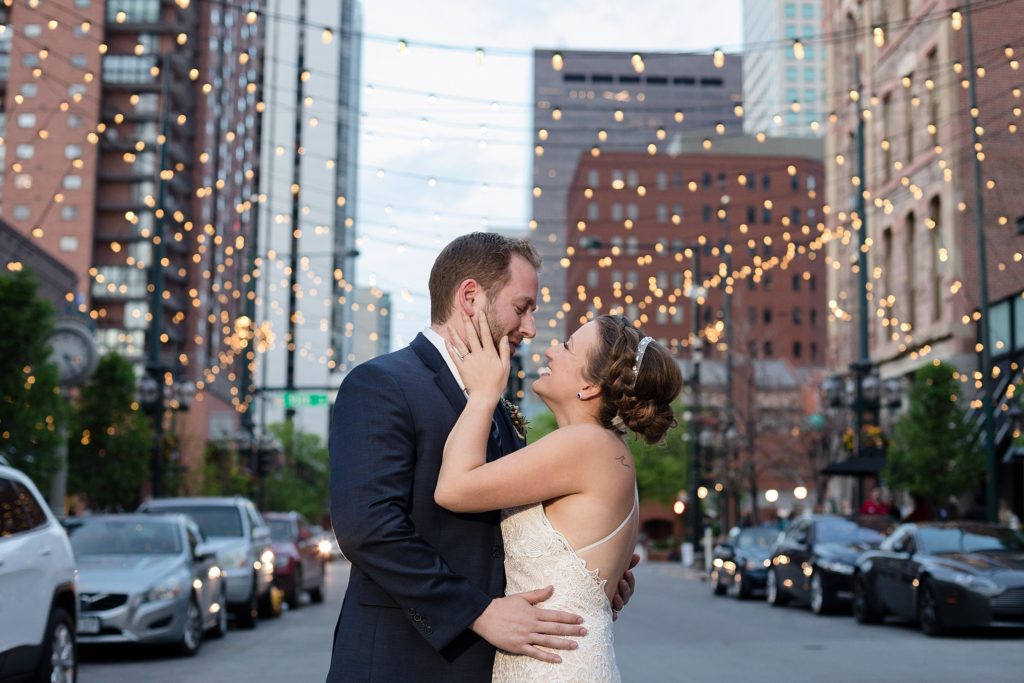 wedding couple looks into each others eyes in larimer square in denver colorado