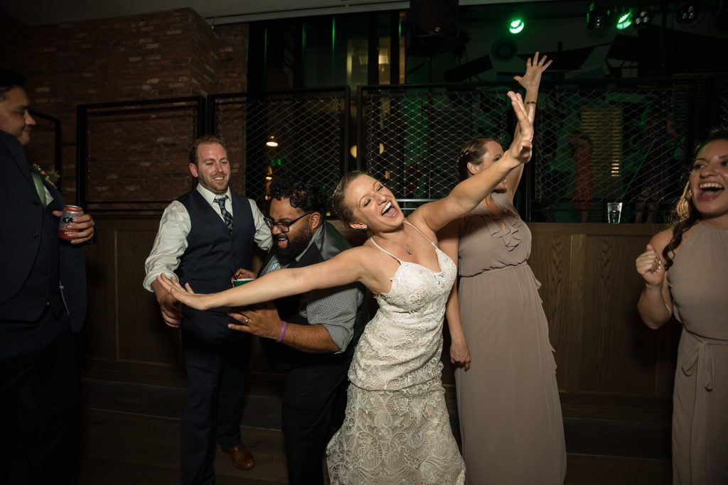 bride dancing at her downtown denver wedding reception