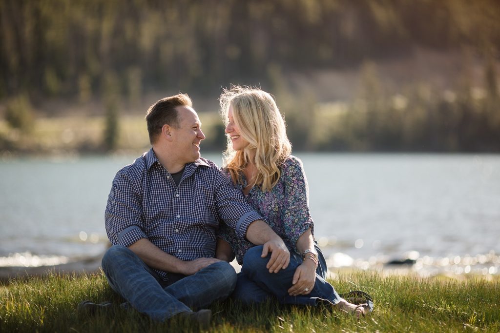 bride and groom to be gaze at each other at lake dillon