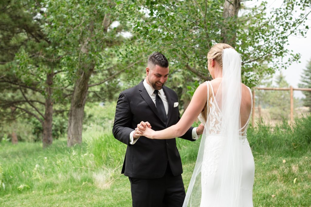 bride and groom first look spruce mountain ranch wedding photographer