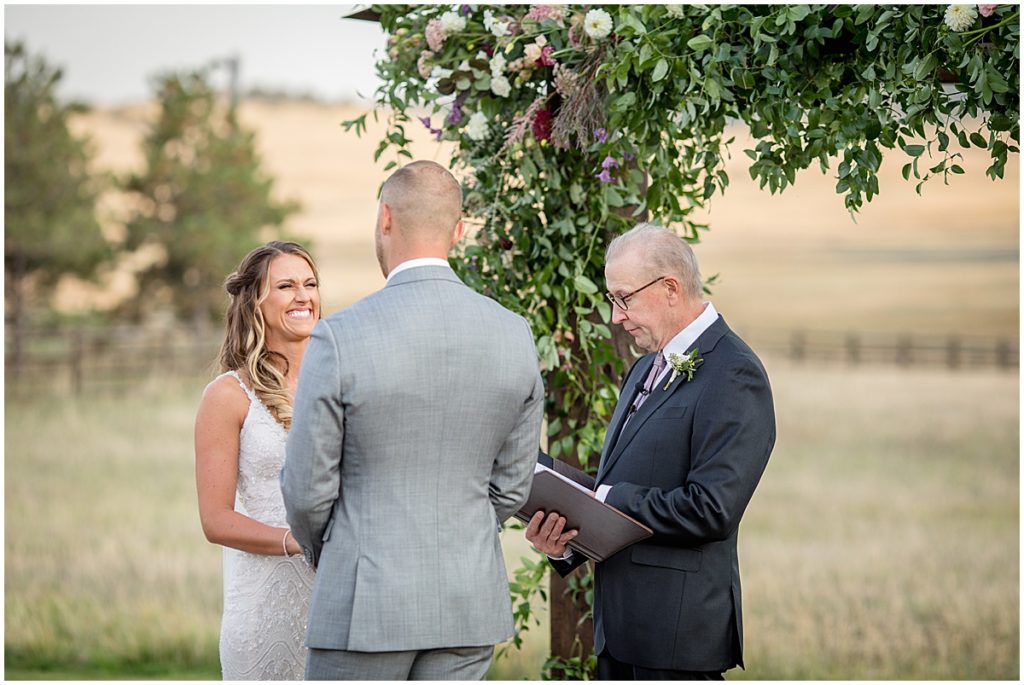 Wedding ceremony with Floral Arch by The Perfect Petal at Spruce Mountain Ranch