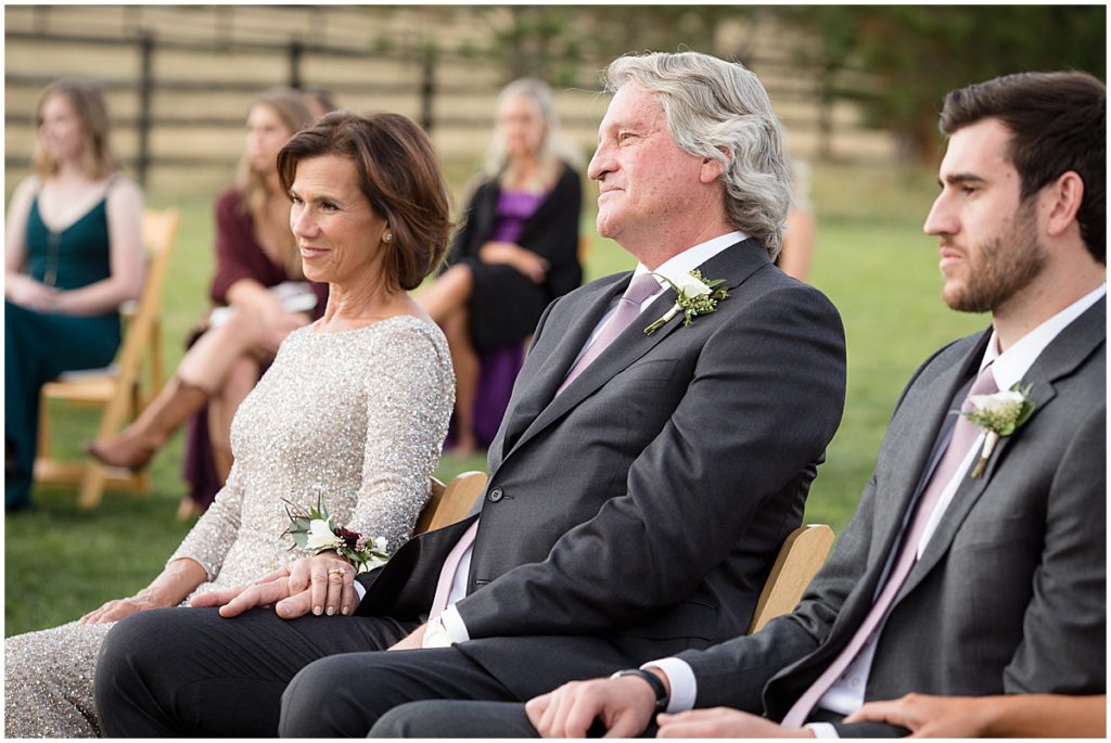 Parents watching wedding ceremony at Spruce Mountain Ranch