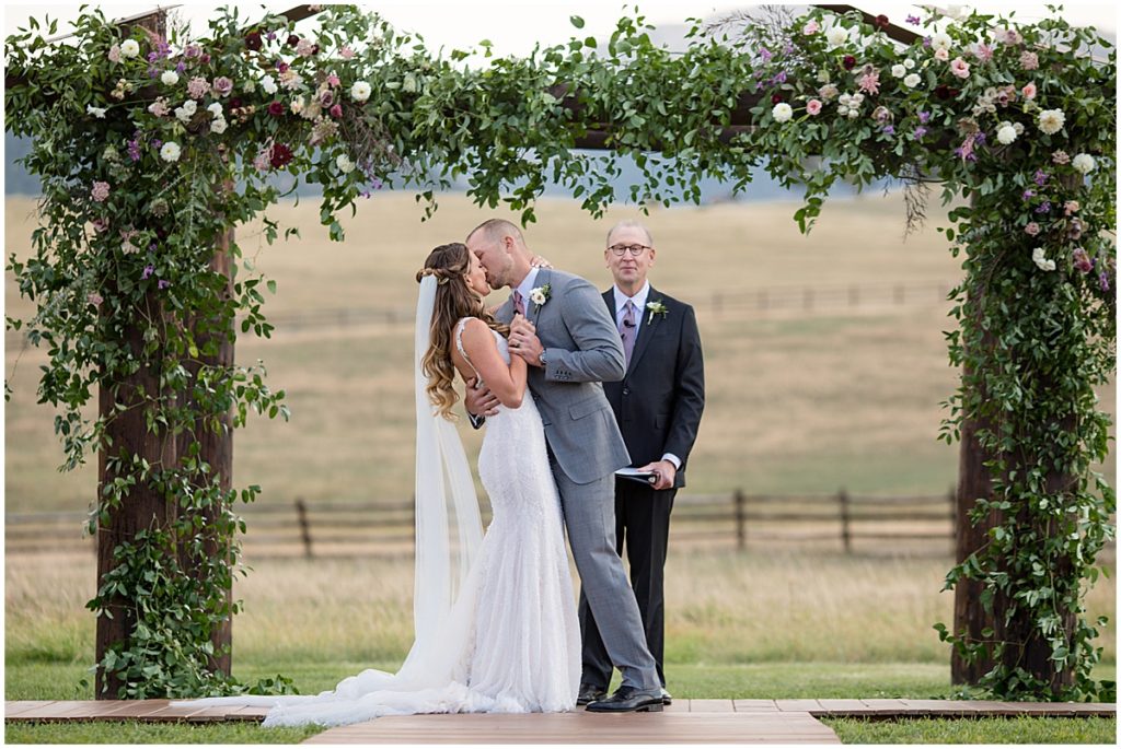 Just married with Floral Arch by The Perfect Petal at Spruce Mountain Ranch Trey's Vista in the Fall
