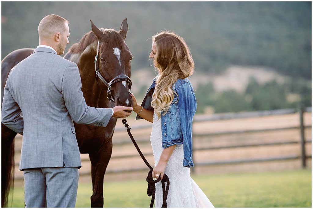 Photograph of bride and groom at Spruce Mountain Ranch with horse