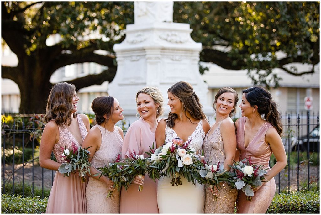Bridal party outside at The Margaret Place Hotel holding floral designed by The Plant Gallery in New Orleans