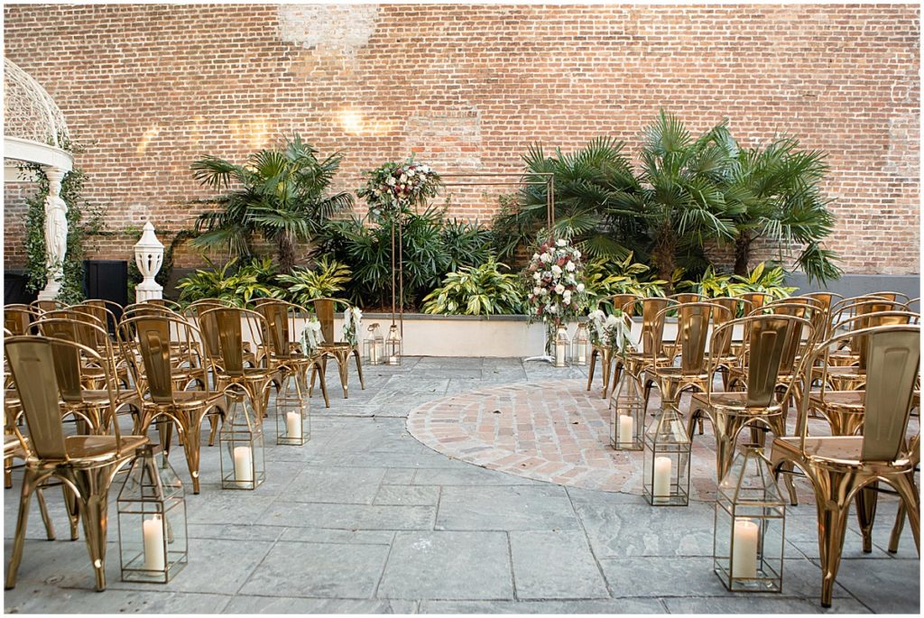Ceremony area facing arch with floral decor by The Plant Gallery at Margaret Place in New Orleans