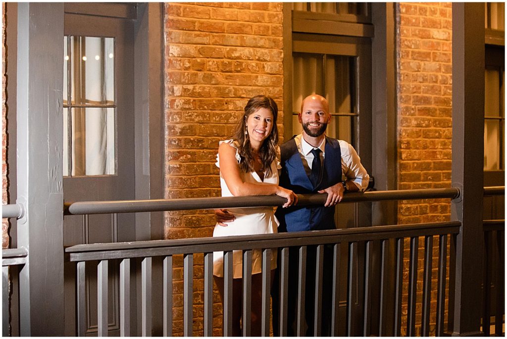 Bride and groom on balcony at Margaret Place Hotel in New Orleans