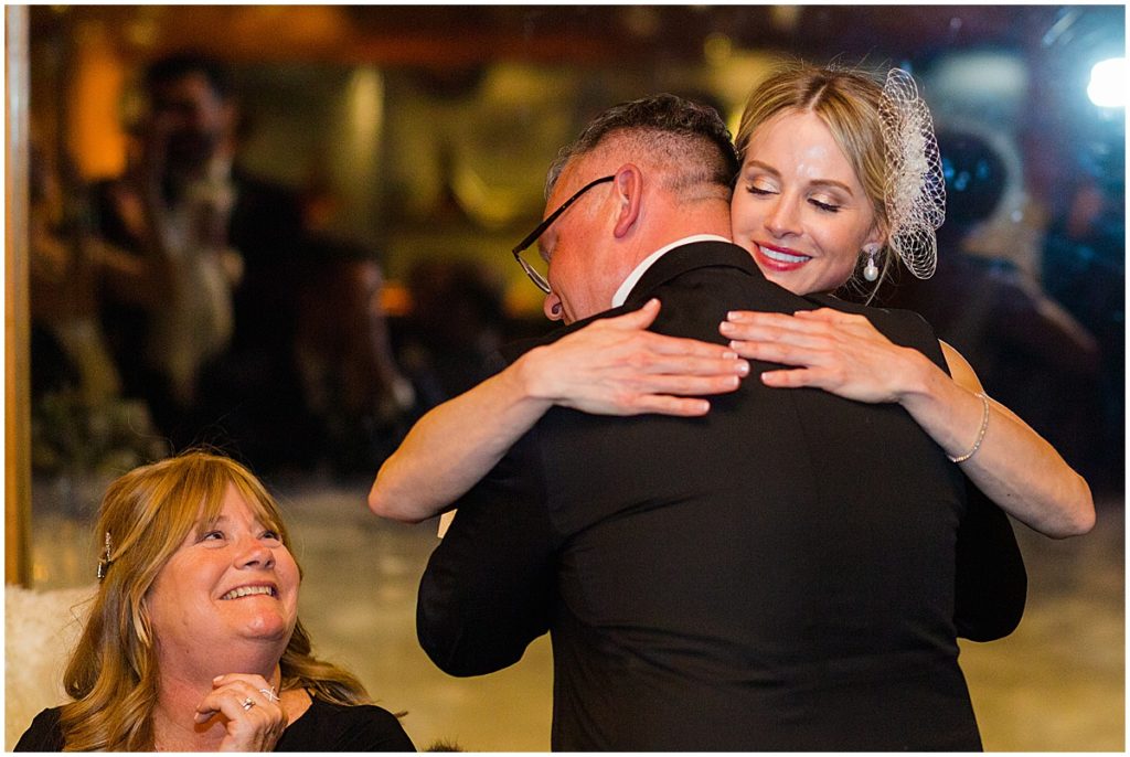 Bride and dad hug at The Pine Creek Cookhouse in Aspen
