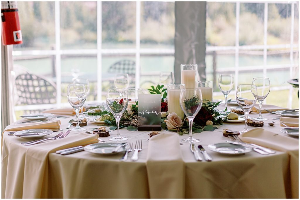 Reception dinner tables at Ski Tip Lodge with floral decoration by Pots & Petals Floral Design