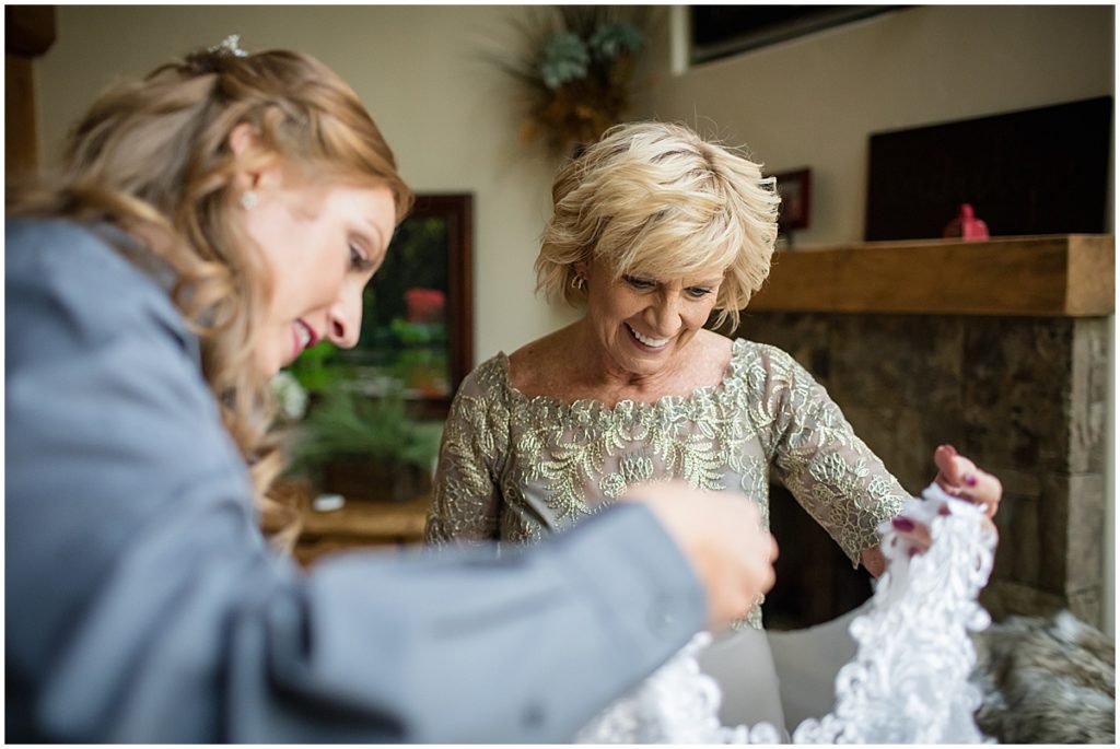 Mother and daughter viewing wedding dress for elopement ceremony at Sapphire Point Breckenridge.