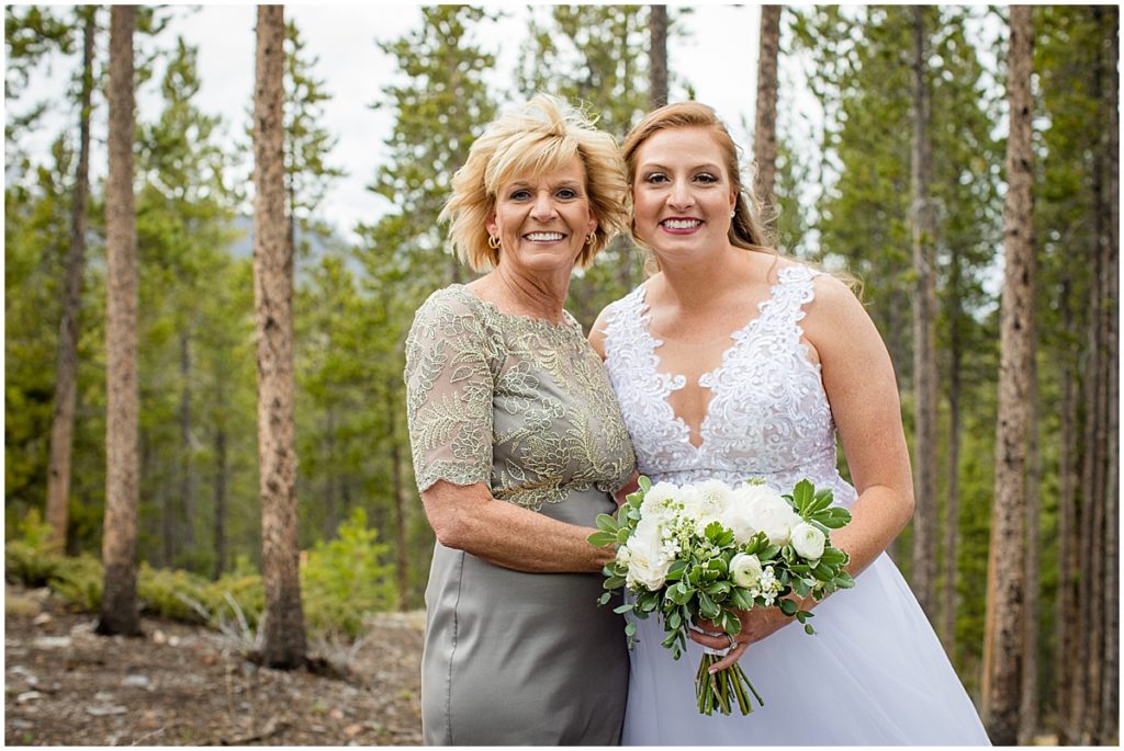 Bride with mom before elopement ceremony at Sapphire Point Breckenridge.