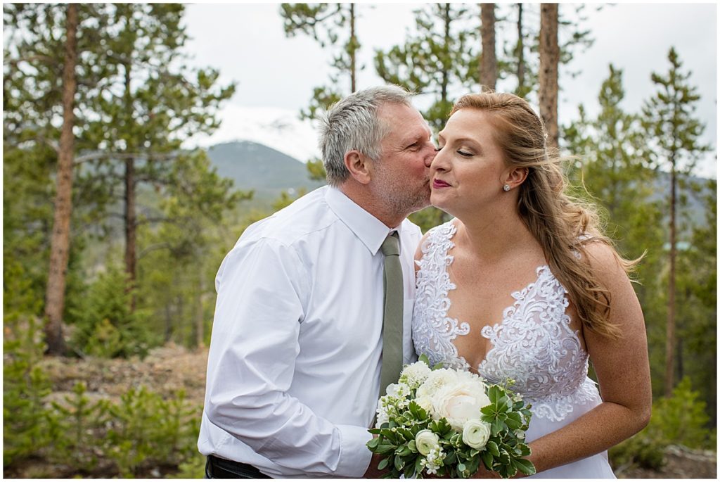 Bride with dad before elopement ceremony at Sapphire Point Breckenridge.