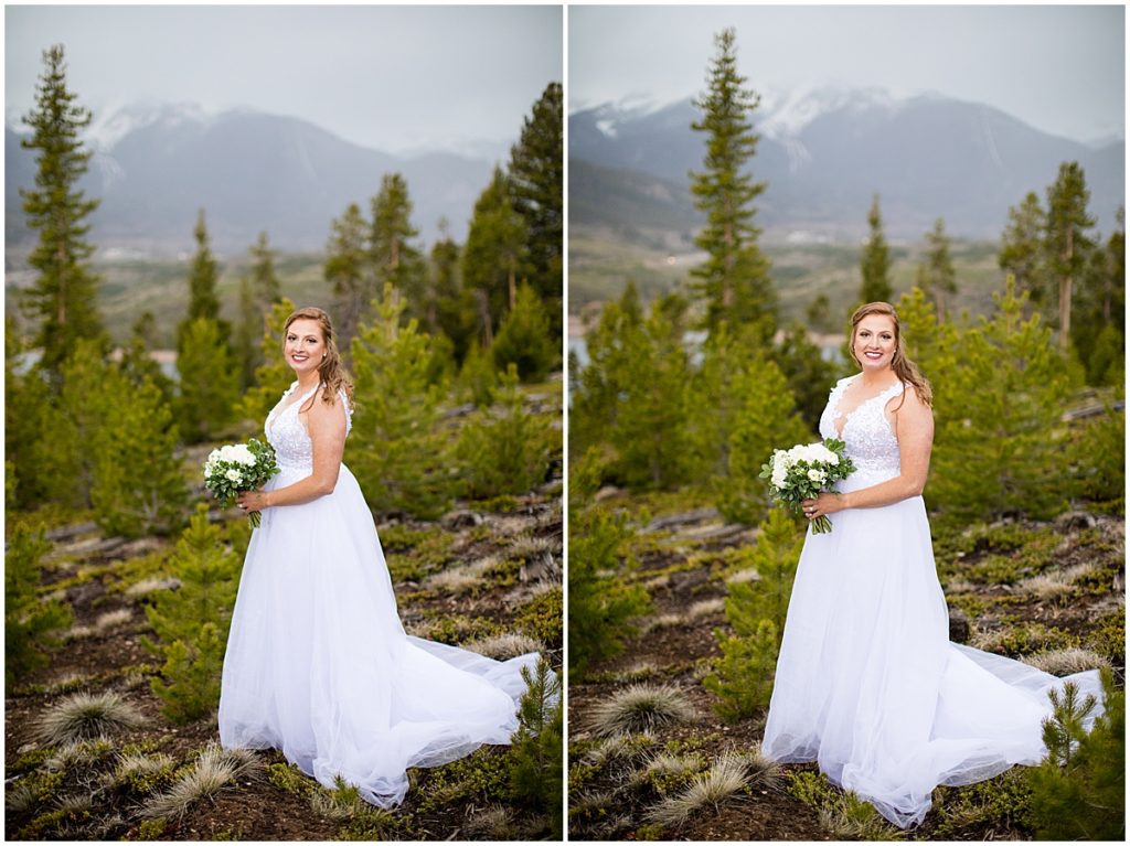 Bride outside holding bouquet designed by Indigo Flowers before elopement ceremony at Sapphire Point in Breckenridge.