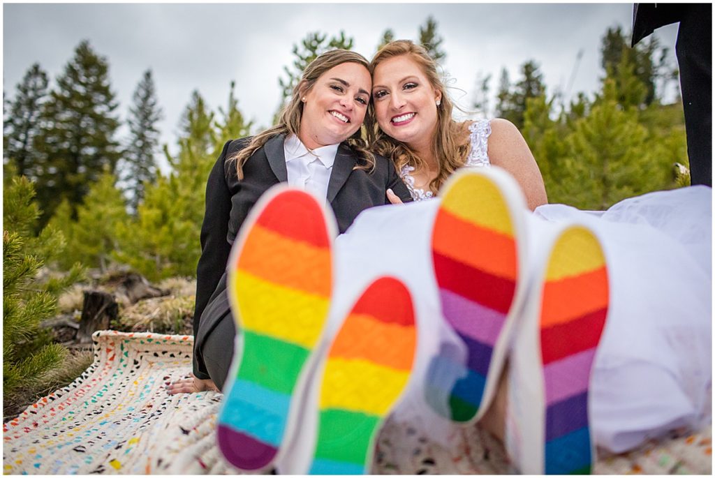 Brides outside before LGBTQ elopement ceremony at Sapphire Point in Breckenridge.