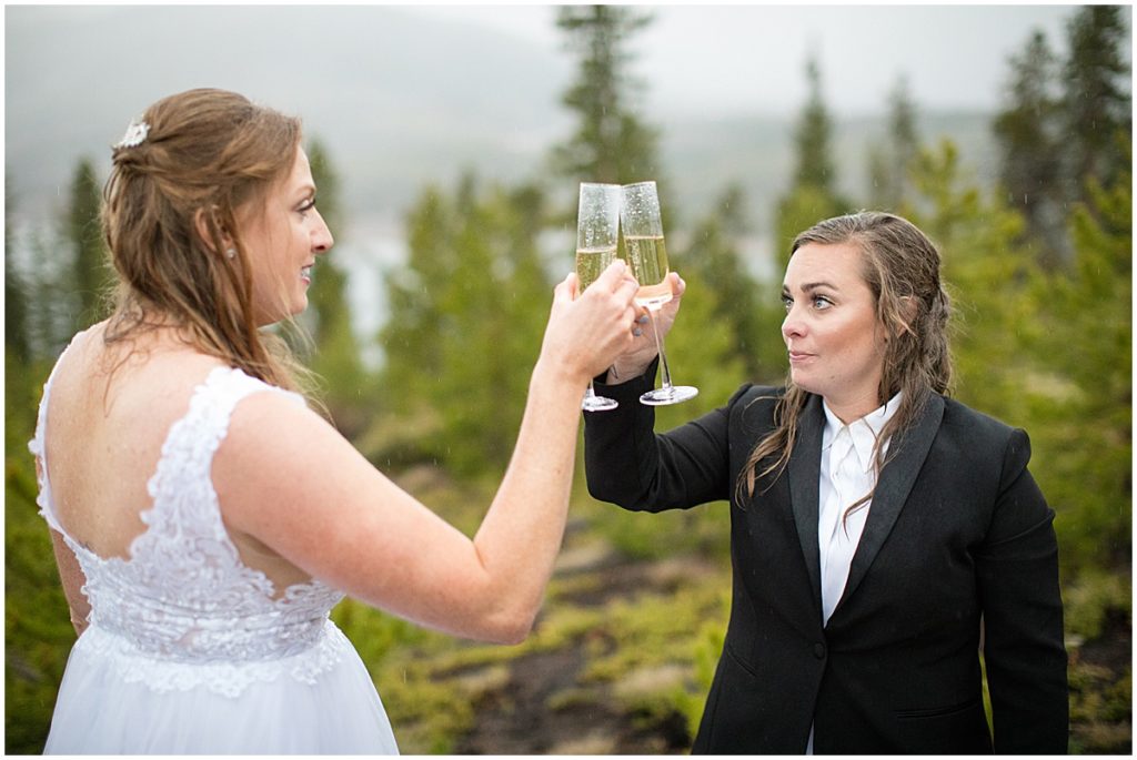 Champagne toast during LGBTQ elopement at Sapphire Point in Breckenridge.
