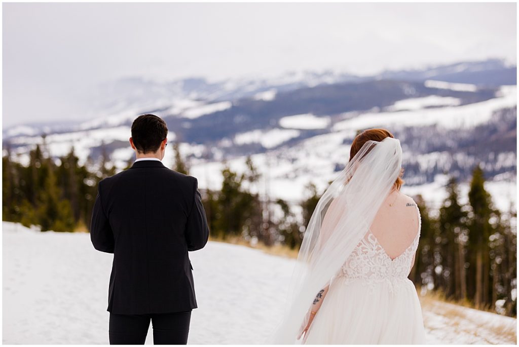 Bride and groom at Sapphire Point in Breckenridge for a micro wedding.  Bride is wearing a dress from Champagne and Lace Bridal.