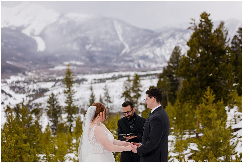 Bride and groom at Sapphire Point in Breckenridge for a micro wedding ceremony.  Bride is wearing a dress from Champagne and Lace Bridal.