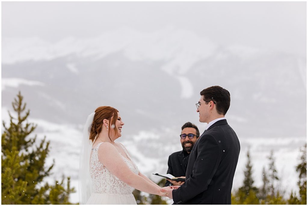 Bride and groom at Sapphire Point in Breckenridge for micro wedding ceremony.  Bride is wearing a dress from Champagne and Lace Bridal.