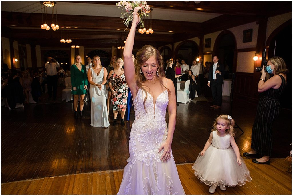 Bride throwing bouquet by Lace and Lilies Flowers at the Stanley Hotel in Estes Park.