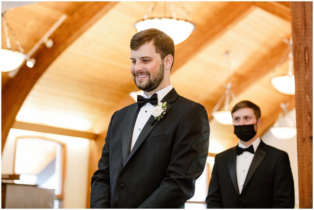 Groom at wedding ceremony at the Vail Chapel.