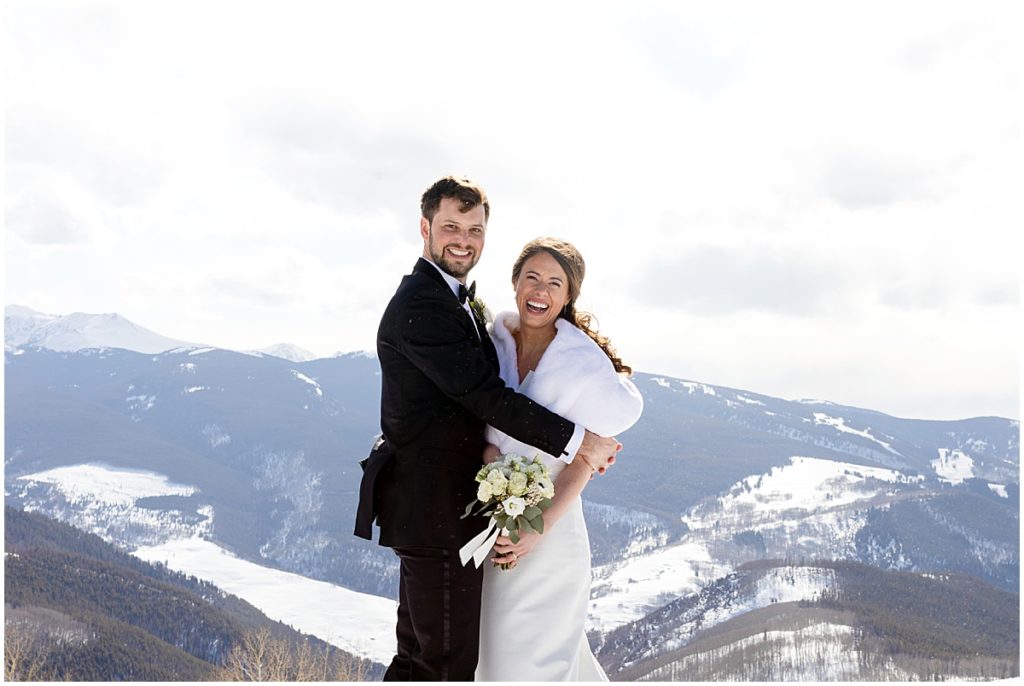 Bride and groom at top of Vail mountain.