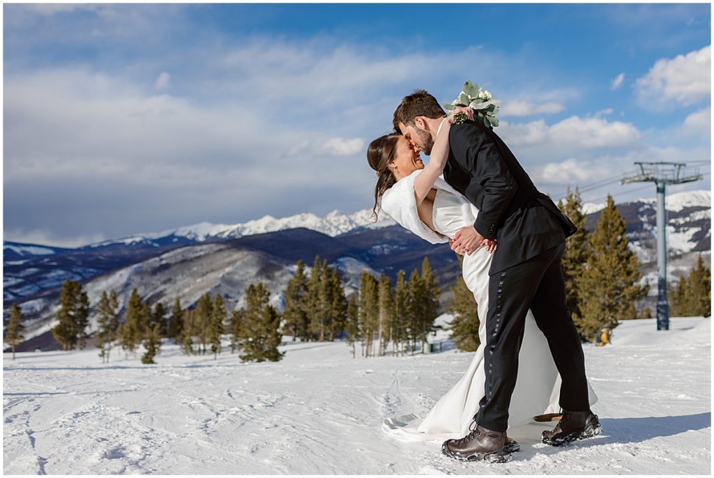 Bride and groom at top of Vail mountain.