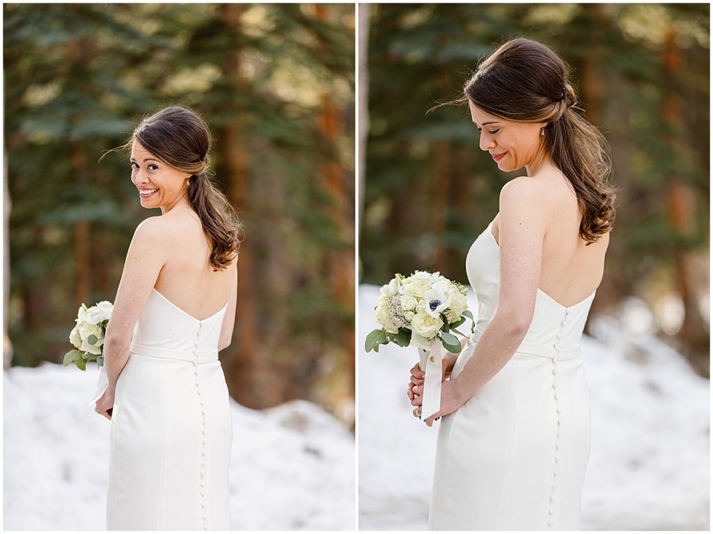 Bride holding bouquet designed by Fancy Pansy at Vail Mountain.