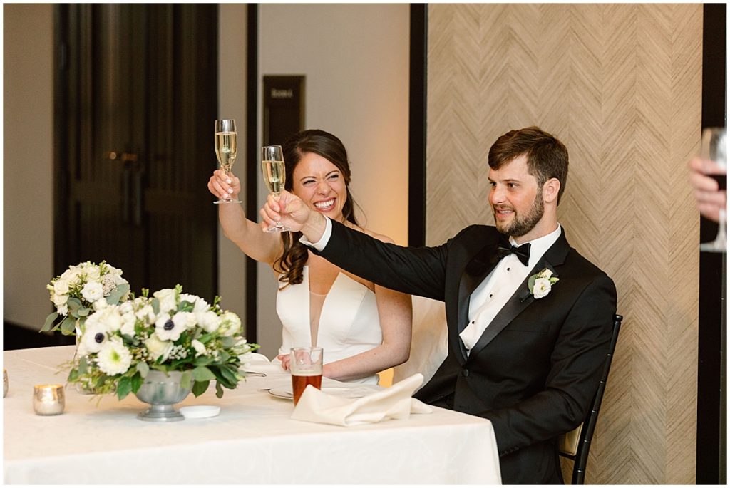 Bride and groom toast during wedding reception at Four Seasons Hotel in Vail.