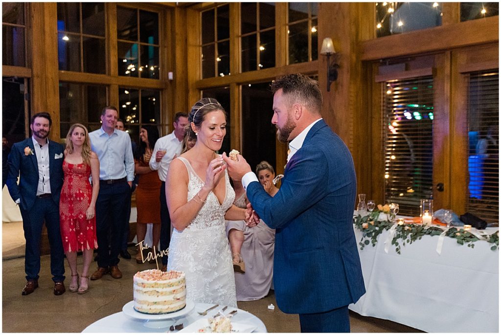 Bride and groom cutting their wedding cake at Donovan Pavilion in Vail.