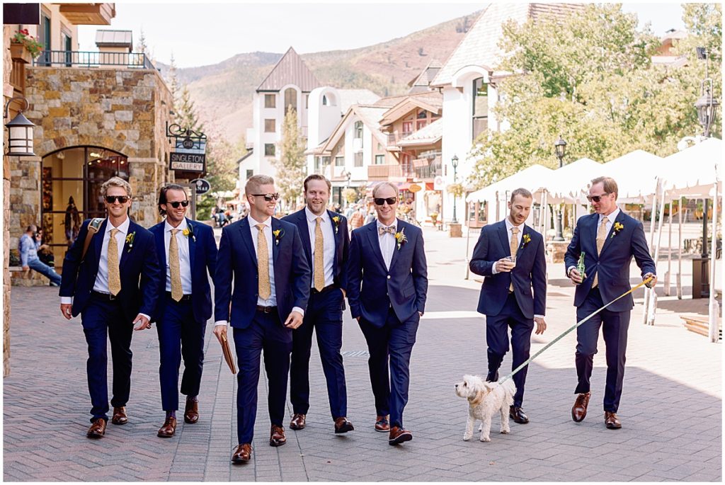 Groom wearing suit from The Suit Shop for wedding in Larkspur Vail.