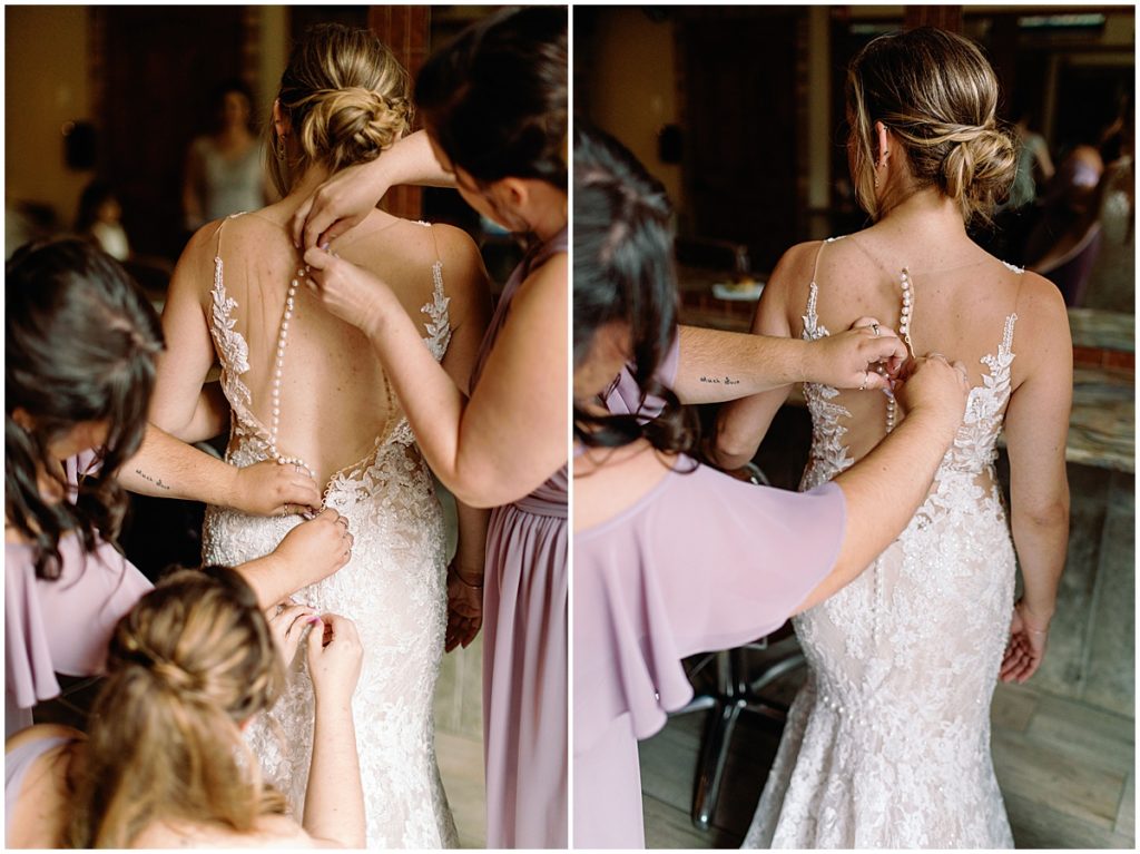 Bride putting on wedding dress designed by Martina Liana from Volle's Bridal & Boutique at Della Terra Mountain Chateau in Estes Park.