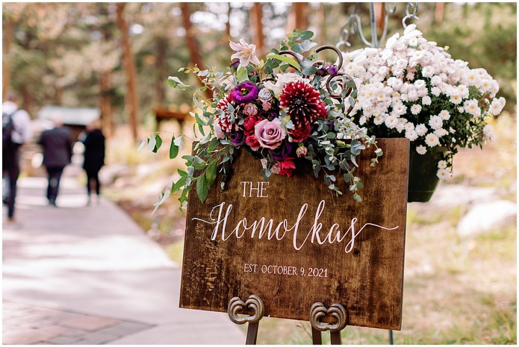 Welcome sign for Wedding at Della Terra Mountain Chateau in Estes Park.  Floral decor by The Perfect Petal.