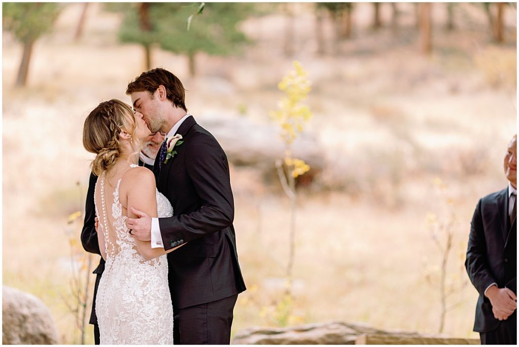 Wedding at Della Terra Mountain Chateau in Estes Park.  Bride wearing wedding dress designed by Martina Liana from Volle's Bridal & Boutique.  Groom Wearing suit from Men's Wearhouse.  
