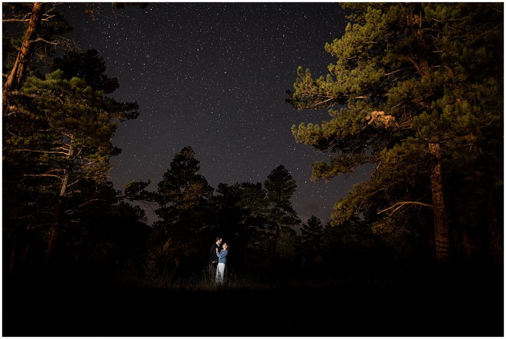 Bride and groom outside at night at Della Terra Mountain Chateau in Estes Park.