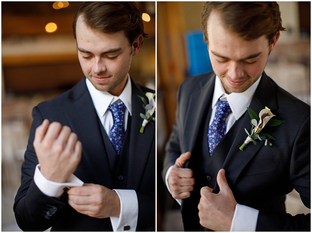 Groom putting on suit for wedding at Della Terra Mountain Chateau in Estes Park.