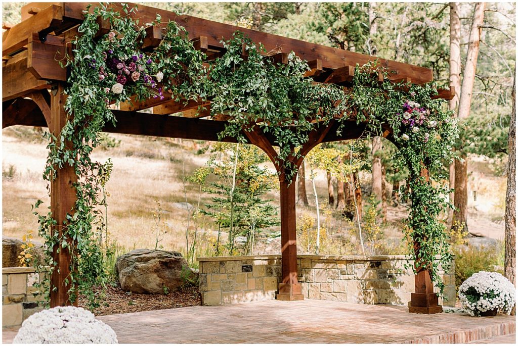 Arch for Wedding at Della Terra Mountain Chateau in Estes Park.  Floral decor by The Perfect Petal.
