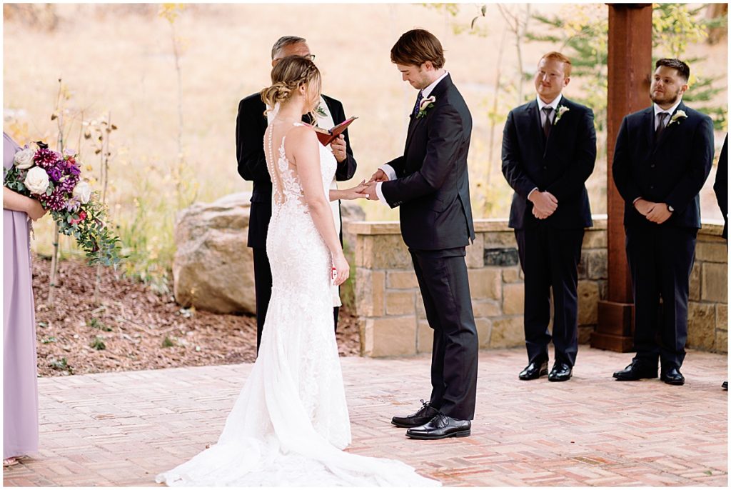 Wedding at Della Terra Mountain Chateau in Estes Park.  Bride wearing wedding dress designed by Martina Liana from Volle's Bridal & Boutique.  Groom Wearing suit from Men's Wearhouse.  
