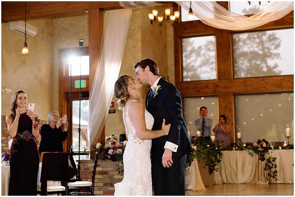 Bride and groom first dance at Della Terra Mountain Chateau in Estes Park.  Bride wearing wedding dress designed by Martina Liana from Volle's Bridal & Boutique.  Groom Wearing suit from Men's Wearhouse. 