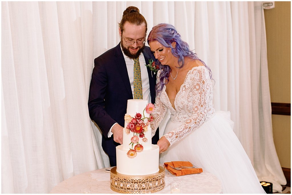 Bride and groom cutting wedding cake at Ritz Carlton Bachelor Gulch in Beaver Creek.