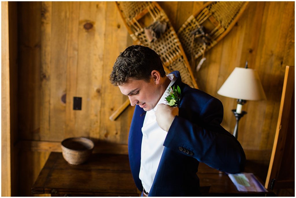 Groom getting ready for wedding at Devil's Thumb Ranch