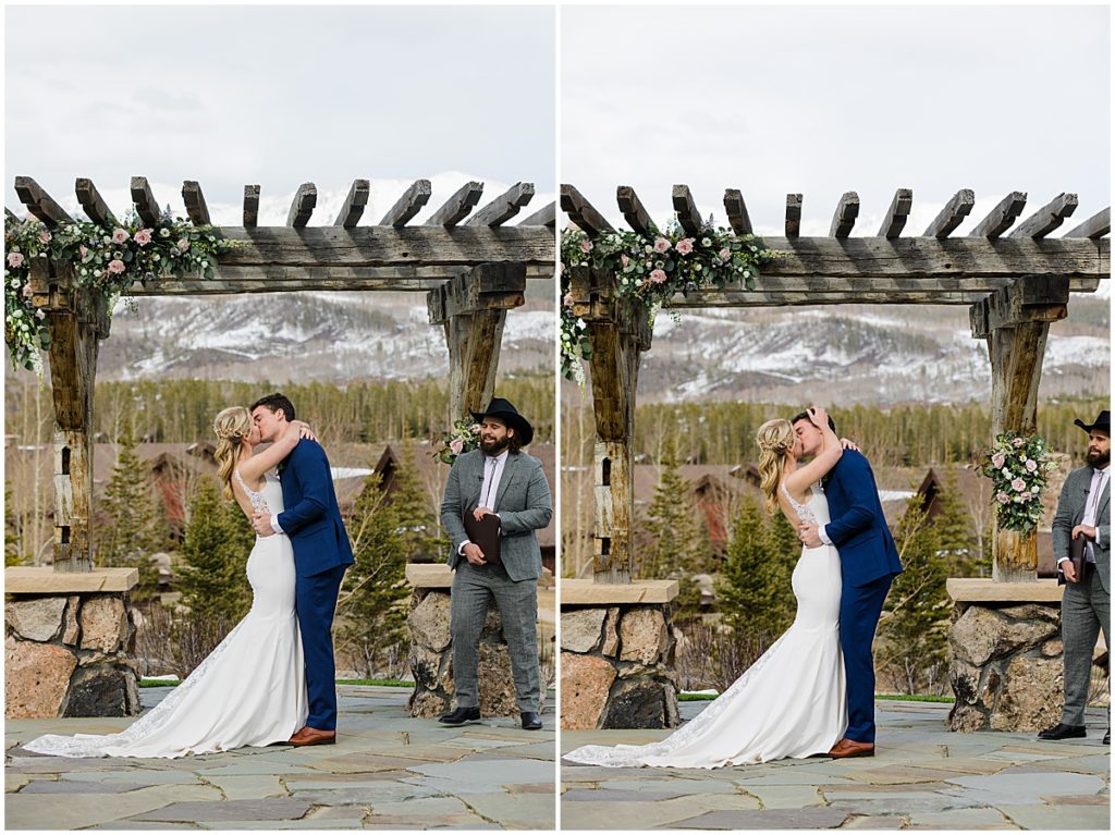 Bride and groom kiss during ceremony at Devil's Thumb Ranch.
