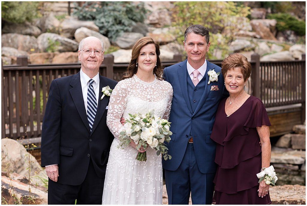 Bride and groom with family after wedding ceremony  at Betty Ford Alpine Gardens in Vail for micro wedding.  