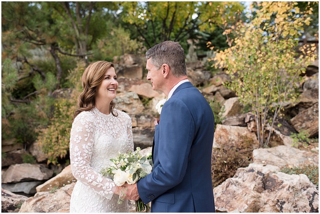 Bride and groom after ceremony pictures at Betty Ford Alpine Gardens in Vail.  