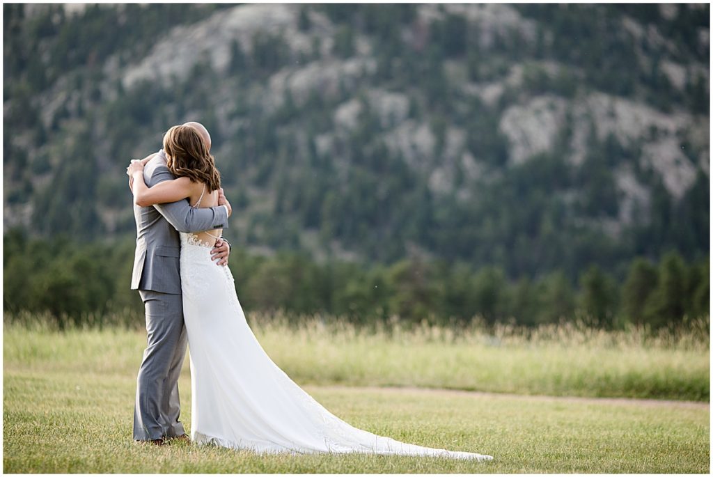 Bride and groom first look for elopement at Three Sisters Park in Evergreen