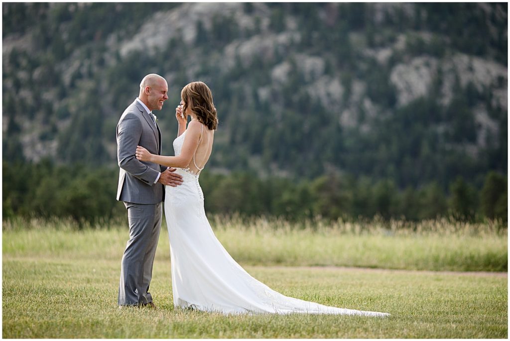 Bride and groom first look for elopement at Three Sisters Park in Evergreen